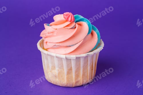 Preview: Beautiful cupcake against saturated dark purple background