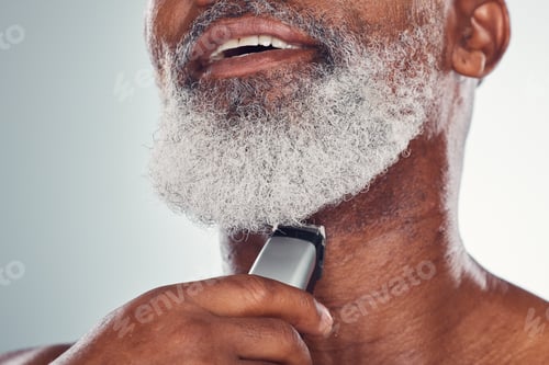 Preview: Grooming, skincare and man shaving beard on face isolated on a grey studio background. Cleaning, sm