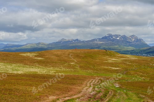 Preview: Scenic Mountain Landscape with Cloudy Sky above Horizon