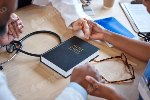 Preview: Hands, bible and a healthcare team praying for a miracle curing a meeting in a hospital office toge