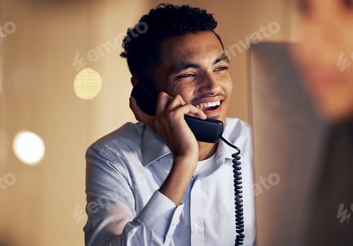 Preview: Telephone, night and businessman on a phone call in the office talking while working on a computer.