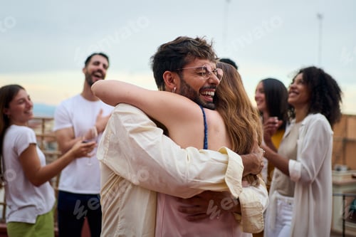 Preview: Happy people sharing a warm gesture of hugging at a leisure event