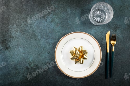 Preview: Christmas table setting with modern dishware and decorations. New Year place setting. tableware