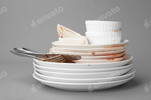 Preview: Set of dirty dishes on grey background