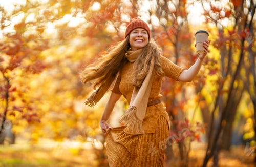 Preview: Woman is walking in the park.