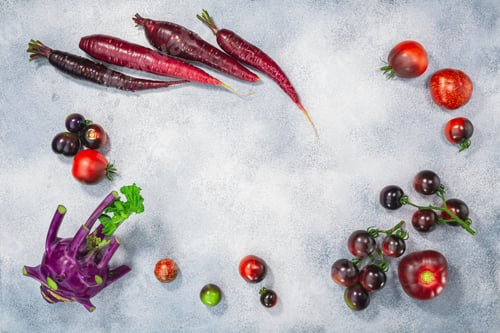 Preview: Anthocyanin-rich vegetables on light textured backdrop, top view