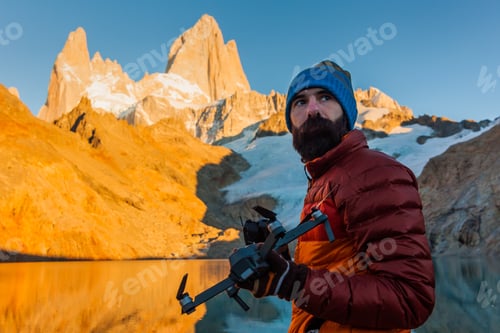 Preview: Tourist with drone on a background of mountain landscape. Patagonia