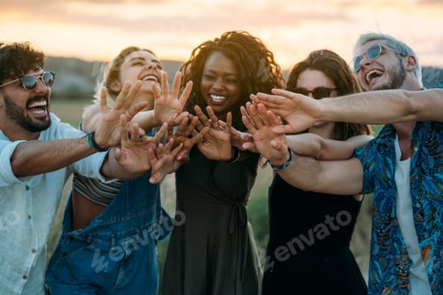 Preview: Young people reaching out hands in nature