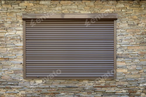 Preview: A window with brown metal rolling shutters. Wall decoration with artificial flatten stone