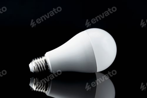 Preview: Light Bulb on Black Background with Reflection