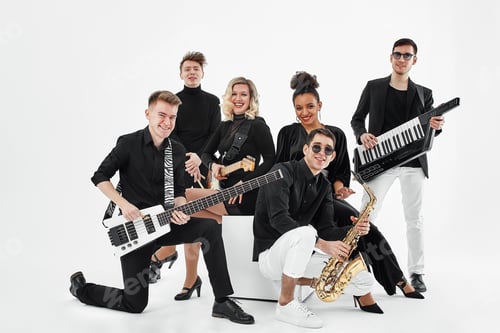 Preview: Multiracial music band on a white background. A group of international musicians rehearsing a