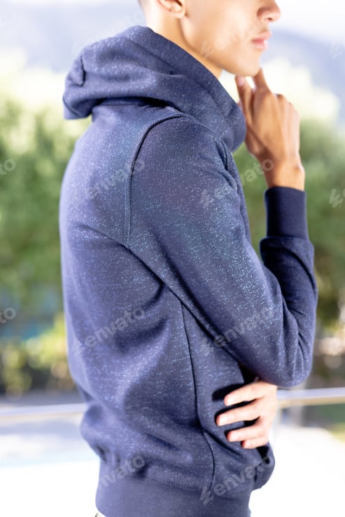 Preview: Image of biracial man in blue long sleeve hooded top with copyspace