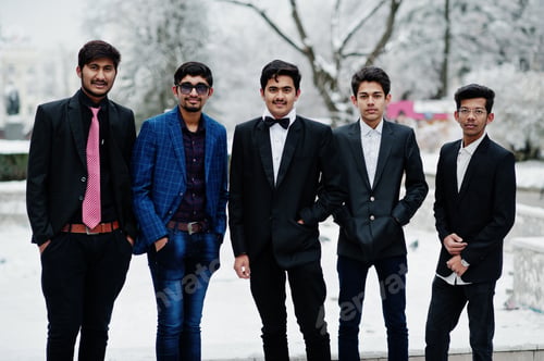 Formally Dressed Young Men Gather Outdoors in Winter