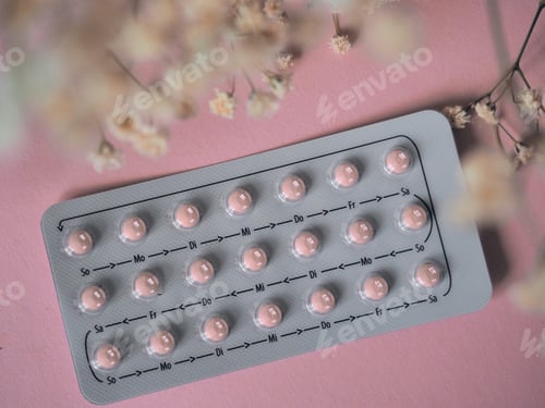 Preview: Birth control pill on pale pink background