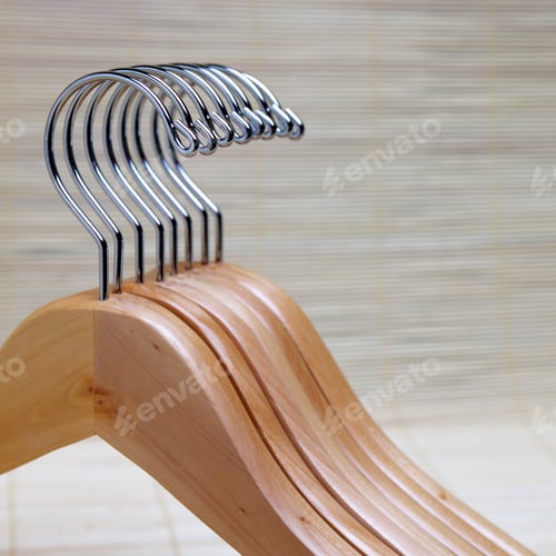 Preview: Wooden Clothes Hangers on Textured Background