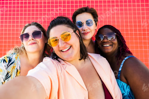 Preview: Group of plus size women with swimwear at the beach