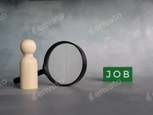 Preview: Wooden doll, magnifying glass and wooden tiles with text JOB