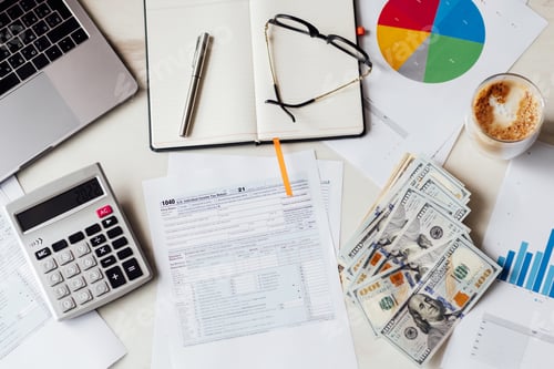 Preview: Flat lay of Individual income tax return form for payment on white marble table working office desk