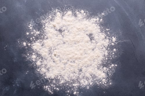 Preview: Baking or cooking background, flour on the dark background.