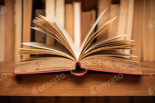 Preview: open book in half in old bookcase world book day