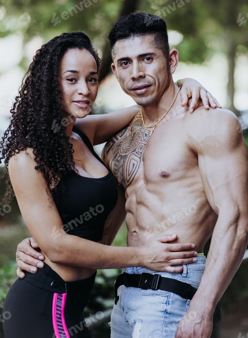 Preview: Vertical photo of a young couple of different ethnicities in good shape