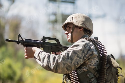 Preview: Military soldier aiming with a rifle