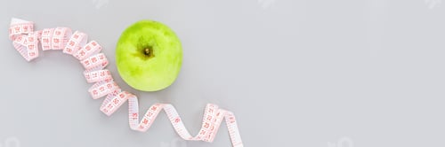 Preview: Horizontal banner for web design with copy space, green apple and measuring tape on gray background
