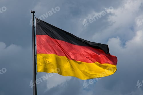 Preview: German flag in front of dark clouds