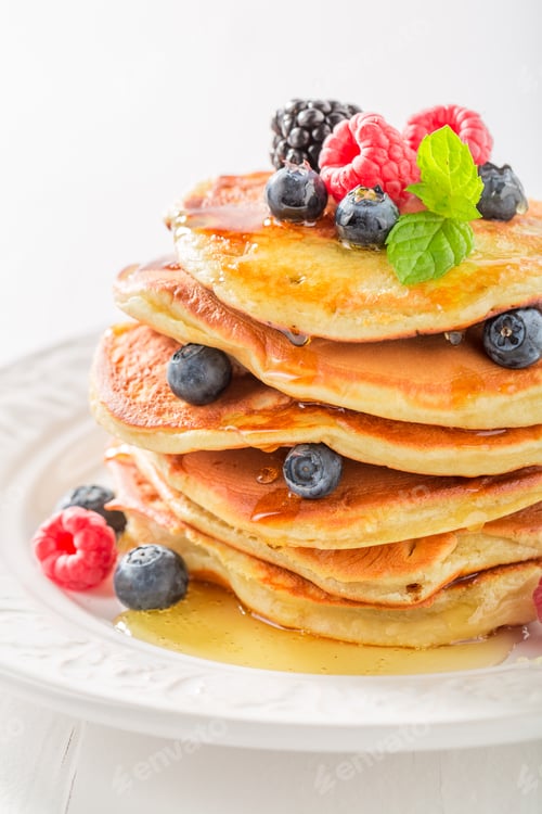 Preview: Closeup of american pancakes with blueberries and raspberries