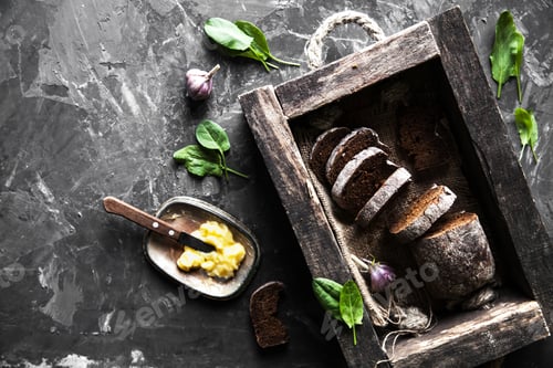 Preview: bread in an old wooden box already cut into pieces. food