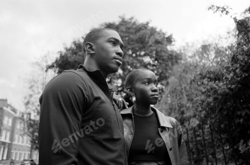 Preview: Analog film portrait of twin brothers outdoors.