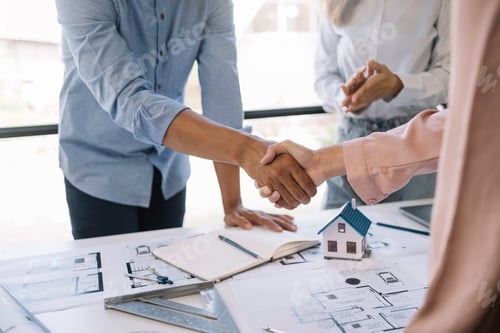 Preview: Architect and engineer work together and shaking hands to welcome home design projects to work in th