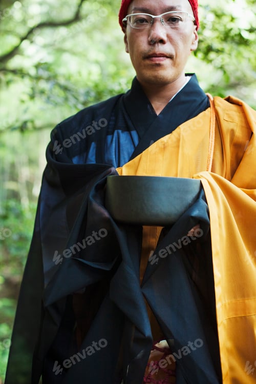 Preview: Buddhist monk carrying an alms bowl