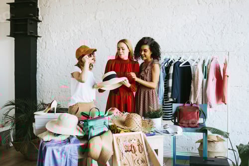 Preview: Three women enjoying fashion in a bright room