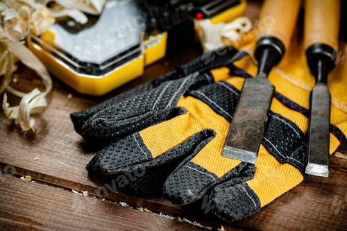 Preview: Chisels with wooden sawdust on the table.