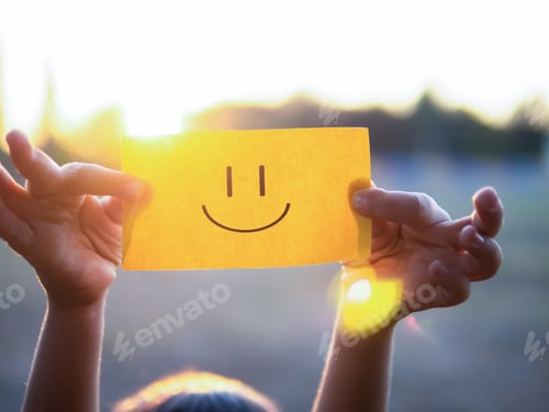 Preview: A kid is holding a paper with positive face
