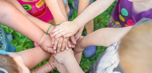 Preview: Children's hands together, street games. Selective focus.