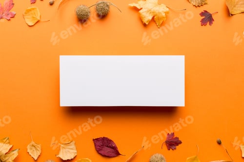 Preview: Autumn composition with paper blank and dried leaves on table. Flat lay, top view, copy space