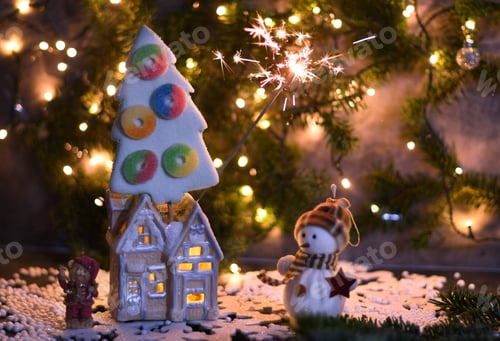 Preview: Christmas party in the toy village, a house with light in the windows and a marshmallow tree, bokeh