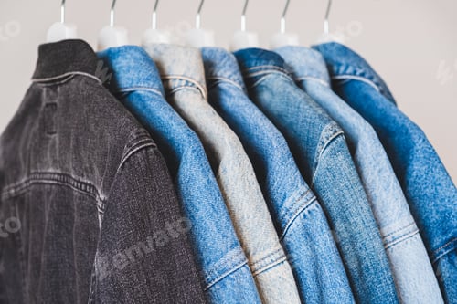 Preview: Denim jackets on hangers.