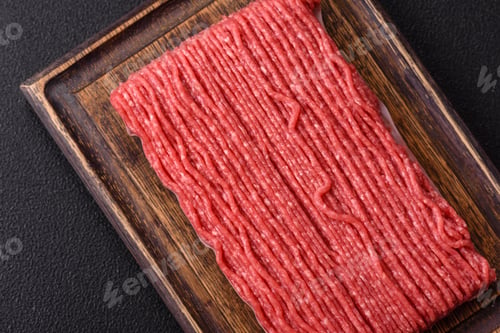Preview: Raw ground beef or pork with salt, spices, herbs and tomatoes