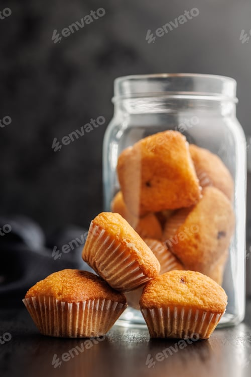 Preview: Magdalenas the typical spanish plain muffins on black table.