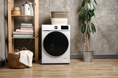Preview: Washing machine in a gray modern laundry room