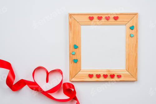 Preview: Wooden frame decorated with hearts and lined heart with red ribbon