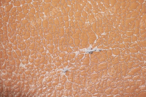 Preview: Detailed view of cracked leather texture in warm tones