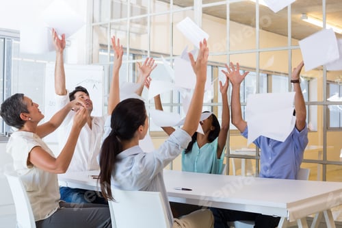 Preview: Group Of Business People Celebrating By Throwing Their Business Papers In The Air