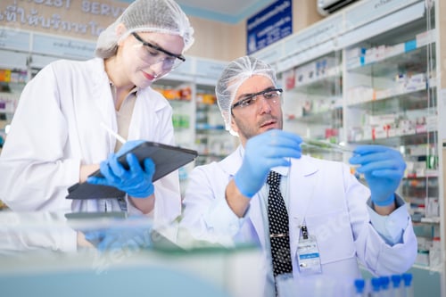 Preview: Pharmacist and chemical scientist doing antibiotic trials and testing in the laboratory