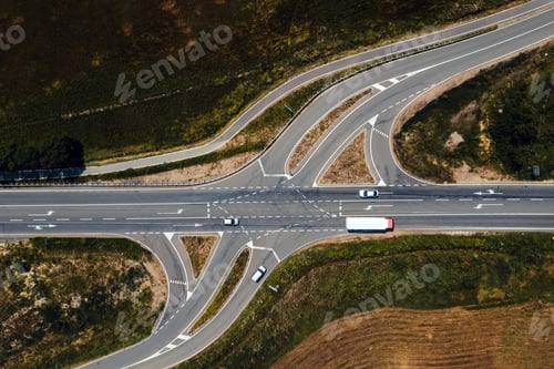 Preview: Aerial view of traffic on road intersection with turning lines