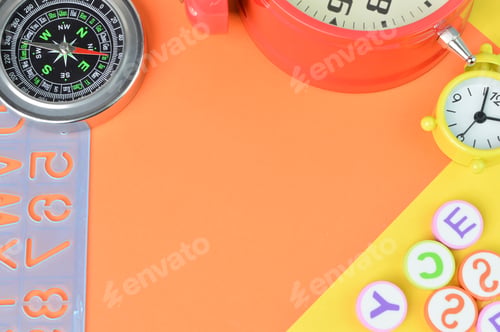Preview: Top view stationery tools on yellow and orange background with copy space.