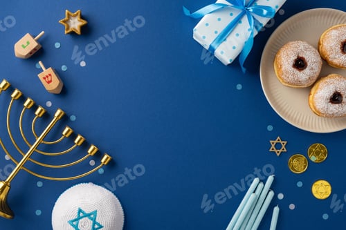Preview: Festive Hanukkah arrangement featuring a menorah, dreidels, gift